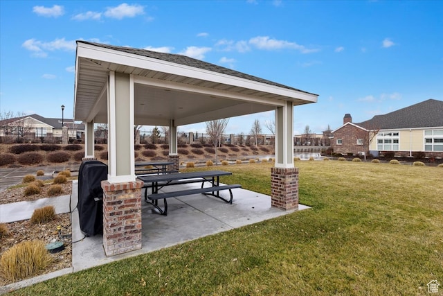 view of nearby features with a yard and a patio area