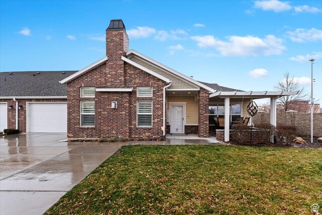 view of front facade with a front yard and a garage