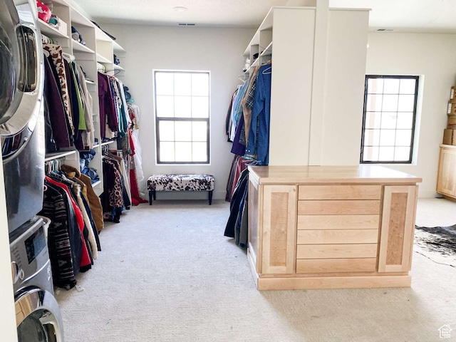 3213 N 4900 W, Malad City, ID 83252 - walk in closet featuring stacked washing maching and dryer and light colored carpet
