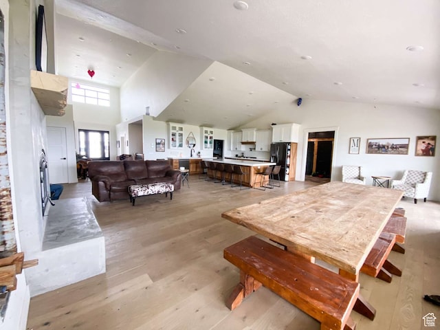 3213 N 4900 W, Malad City, ID 83252 - dining room featuring high vaulted ceiling and light hardwood / wood-style floors