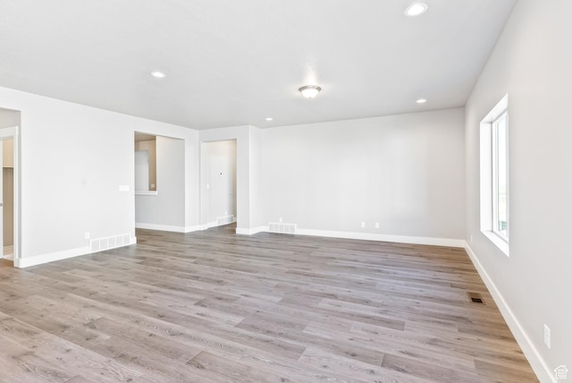 unfurnished room featuring light wood-type flooring