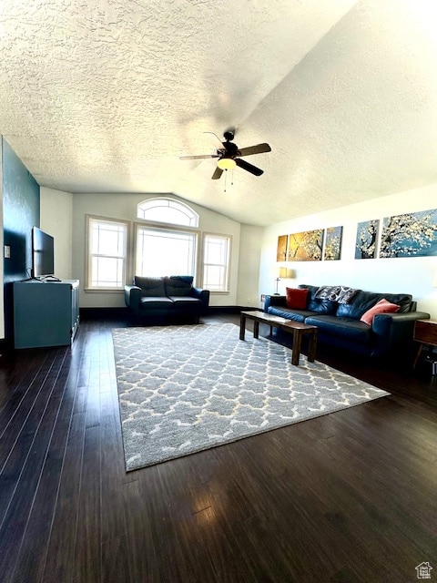 unfurnished living room with a textured ceiling, dark hardwood / wood-style floors, vaulted ceiling, and ceiling fan