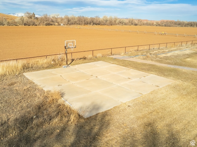 view of sport court featuring a rural view