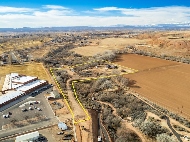 drone / aerial view featuring a mountain view