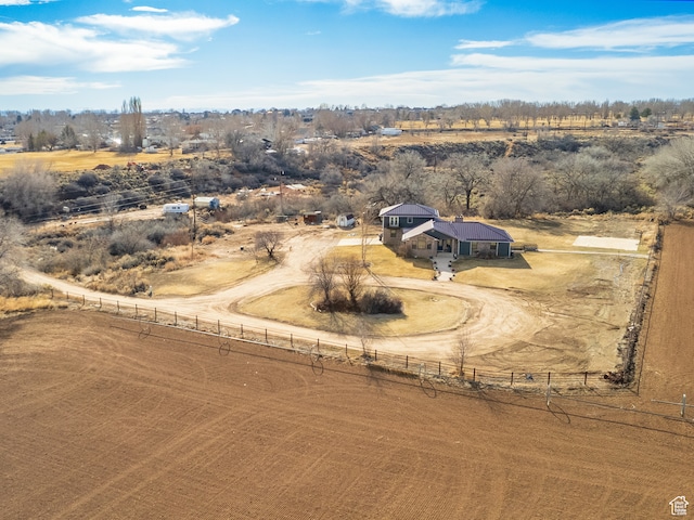 birds eye view of property with a rural view