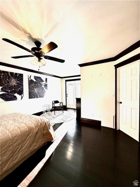 unfurnished bedroom featuring ceiling fan, crown molding, and dark hardwood / wood-style flooring