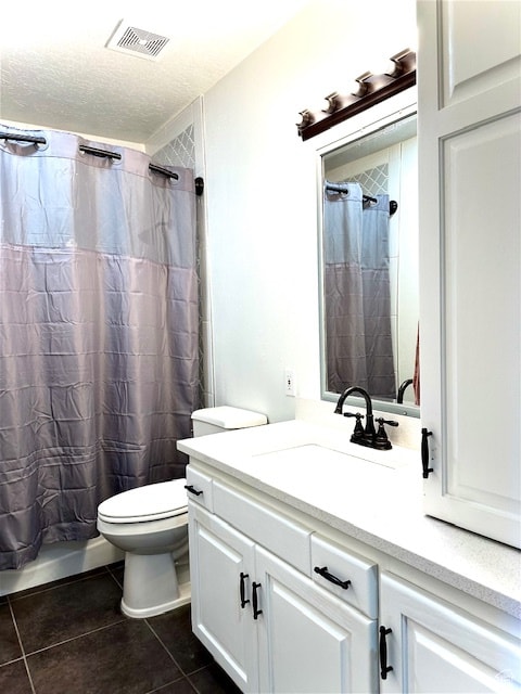 full bathroom with shower / tub combo, tile patterned floors, a textured ceiling, toilet, and vanity