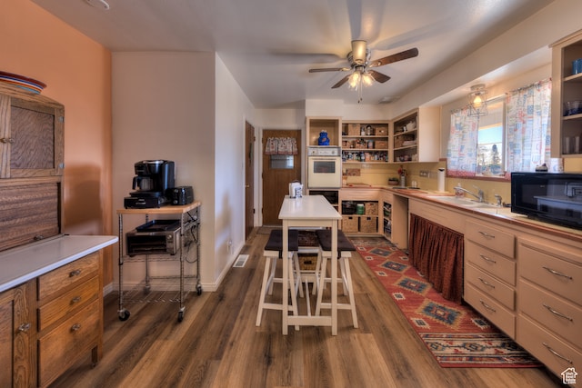 165 E 200 S, Monticello, UT 84535 - kitchen with ceiling fan, sink, double oven, and dark hardwood / wood-style flooring