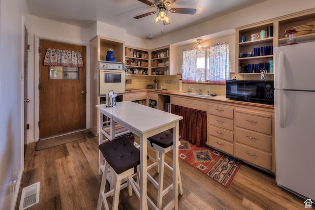 165 E 200 S, Monticello, UT 84535 - kitchen with light hardwood / wood-style floors, ceiling fan, white refrigerator, and sink