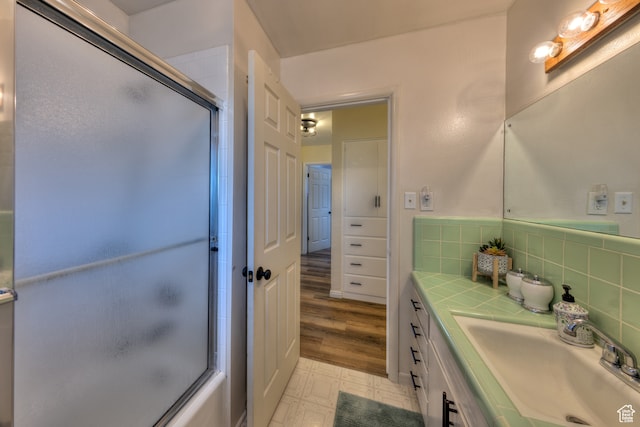 165 E 200 S, Monticello, UT 84535 - bathroom featuring vanity, tile floors, and tasteful backsplash