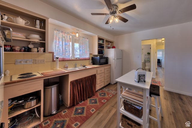 165 E 200 S, Monticello, UT 84535 - kitchen featuring ceiling fan, white appliances, sink, tasteful backsplash, and dark hardwood / wood-style flooring
