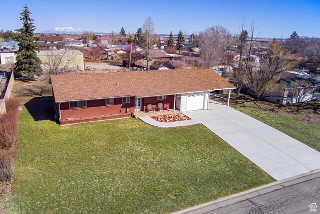 165 E 200 S, Monticello, UT 84535 - ranch-style home featuring a front yard and a garage