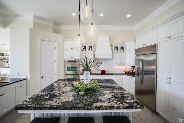 836 E St James Ln, St George, UT 84790 - kitchen featuring pendant lighting, a kitchen island, ornamental molding, appliances with stainless steel finishes, and white cabinetry