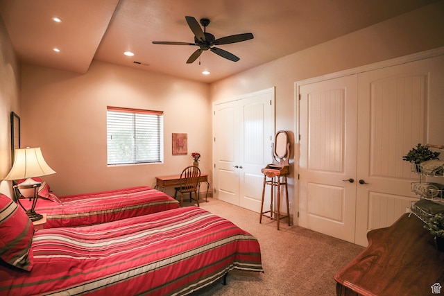 836 E St James Ln, St George, UT 84790 - bedroom featuring two closets, ceiling fan, and light colored carpet