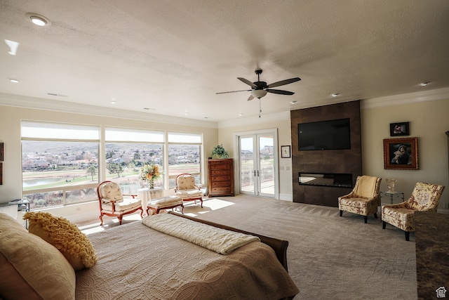 836 E St James Ln, St George, UT 84790 - bedroom featuring ceiling fan, carpet flooring, access to exterior, a tile fireplace, and french doors