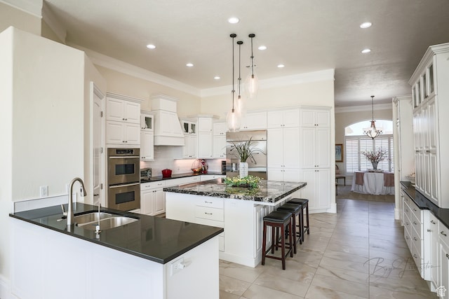 836 E St James Ln, St George, UT 84790 - kitchen with a kitchen island, ornamental molding, stainless steel appliances, an inviting chandelier, and decorative light fixtures