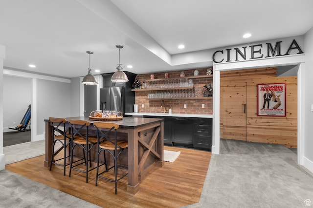 3297 W Blue Springs Ln, Bluffdale, UT 84065 - bar featuring sink, stainless steel fridge with ice dispenser, wood walls, light hardwood / wood-style floors, and decorative light fixtures