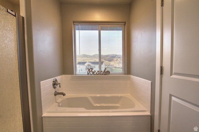 55 W Buttercup Ln Unit 26, Garden City, UT 84028 - bathroom featuring tiled tub