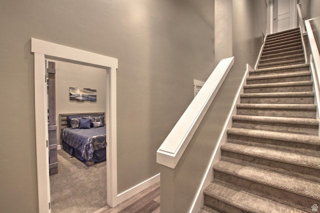 55 W Buttercup Ln Unit 26, Garden City, UT 84028 - staircase with dark carpet
