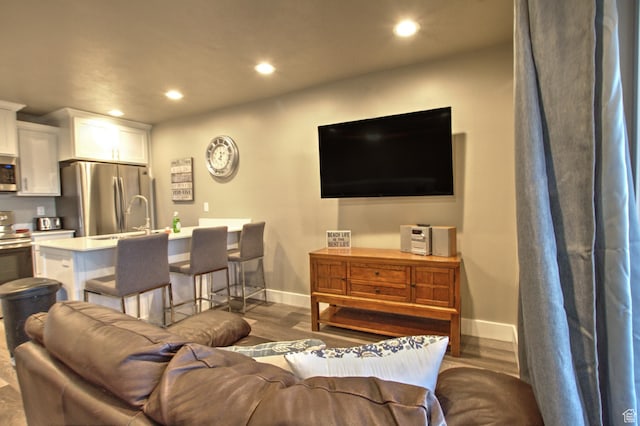 55 W Buttercup Ln Unit 26, Garden City, UT 84028 - living room with dark hardwood / wood-style flooring and sink
