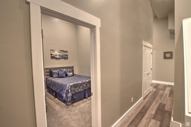 55 W Buttercup Ln Unit 26, Garden City, UT 84028 - corridor featuring dark hardwood / wood-style floors and a high ceiling