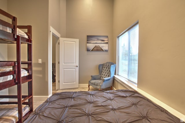 55 W Buttercup Ln Unit 26, Garden City, UT 84028 - unfurnished bedroom featuring light carpet and a towering ceiling
