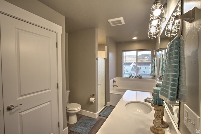 55 W Buttercup Ln Unit 26, Garden City, UT 84028 - bathroom with a bathtub, an inviting chandelier, sink, toilet, and hardwood / wood-style flooring