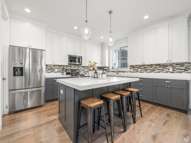 632 W 1460 S, Spanish Fork, UT 84660 - kitchen featuring gray cabinetry, light hardwood / wood-style floors, stainless steel appliances, and a center island