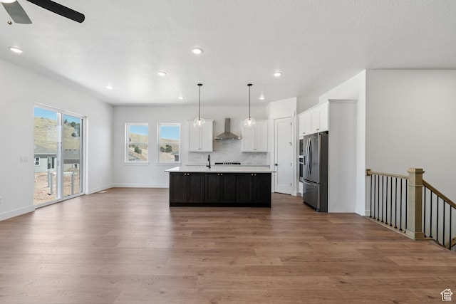 1260 Crest Dale Ln, Santaquin, UT 84655 - kitchen featuring light countertops, wood finished floors, open floor plan, stainless steel refrigerator with ice dispenser, and ceiling fan