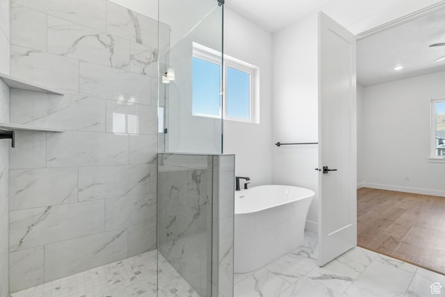 1260 Crest Dale Ln, Santaquin, UT 84655 - bathroom with a freestanding tub, a walk in shower, marble finish floor, baseboards, and recessed lighting