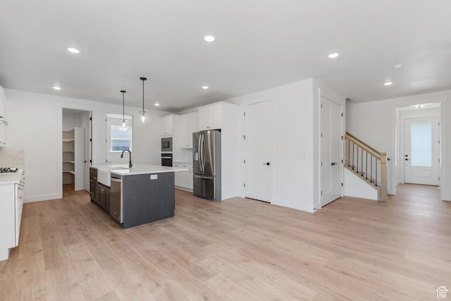 1263 Crest Dale Ln, Santaquin, UT 84655 - kitchen with white cabinetry, light countertops, stainless steel appliances, and light wood finished floors