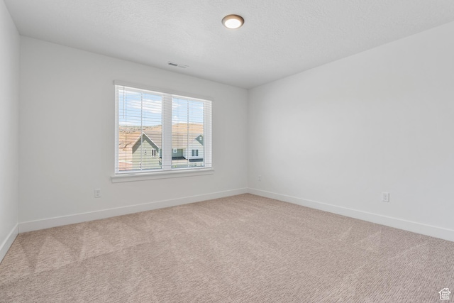 1263 Crest Dale Ln, Santaquin, UT 84655 - carpeted spare room featuring baseboards, a textured ceiling, and visible vents