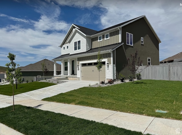 view of front of house with a standing seam roof, fence, board and batten siding, metal roof, and a garage