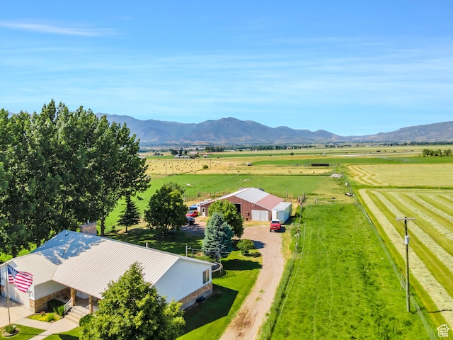 birds eye view of property with a mountain view and a rural view