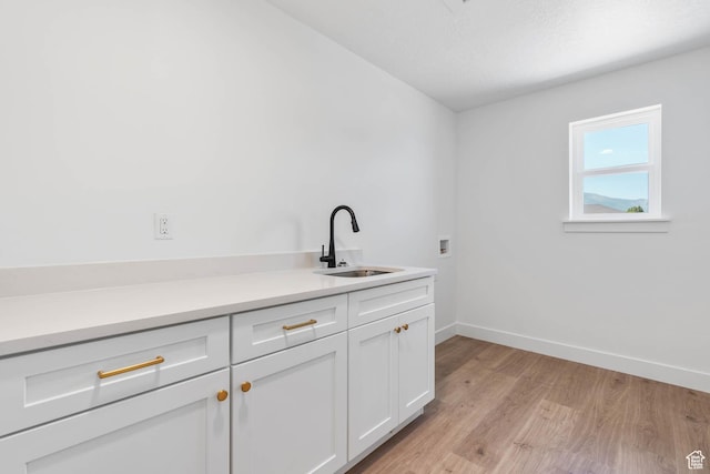 1208 W View Dr S, Santaquin, UT 84655 - washroom featuring cabinet space, light wood-style flooring, and washer hookup
