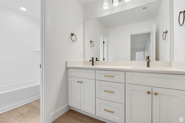 1208 W View Dr S, Santaquin, UT 84655 - bathroom with double vanity, wood finished floors, and shower / bath combination