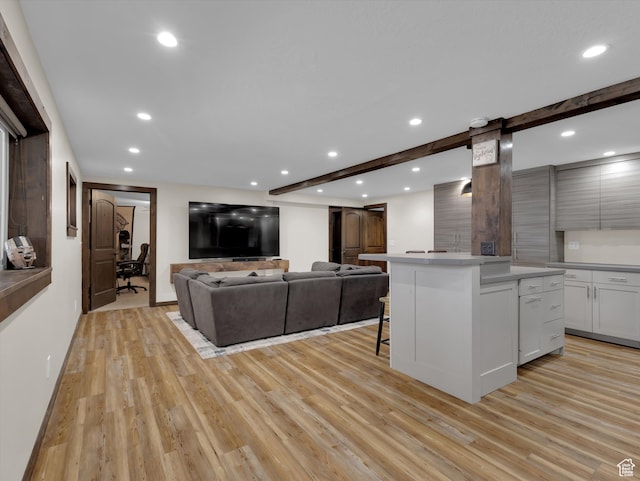 1271 E Oakridge Rd S, Park City, UT 84098 - living area with light wood finished floors, a barn door, beam ceiling, and recessed lighting