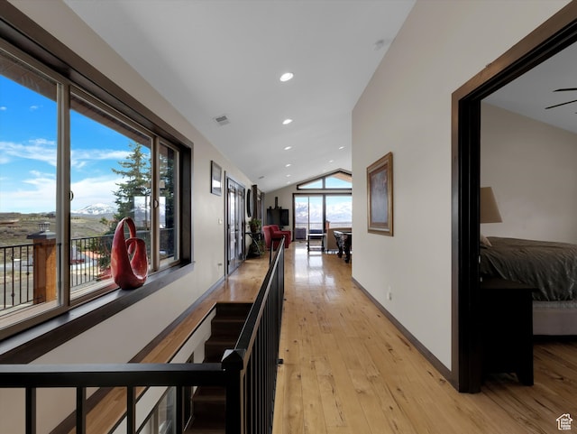 1271 E Oakridge Rd S, Park City, UT 84098 - hallway with baseboards, visible vents, vaulted ceiling, an upstairs landing, and light wood-style floors
