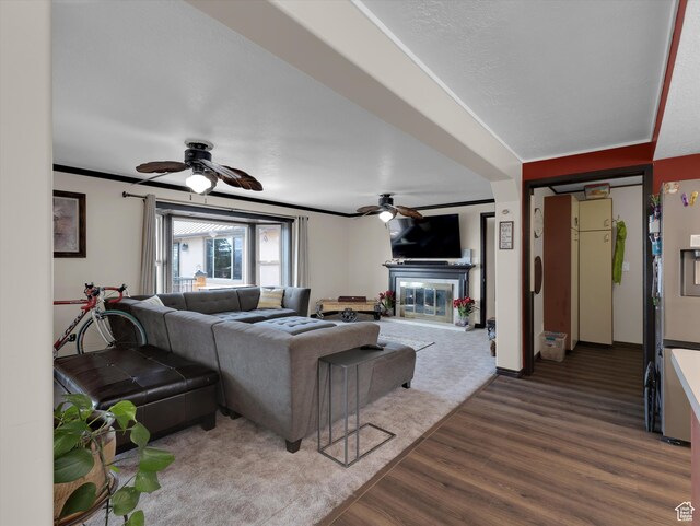1271 E Oakridge Rd S, Park City, UT 84098 - living room with a ceiling fan, a glass covered fireplace, ornamental molding, and wood finished floors