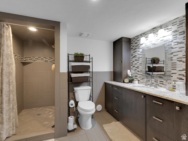 1271 E Oakridge Rd S, Park City, UT 84098 - full bath with a wainscoted wall, tile walls, toilet, a stall shower, and vanity
