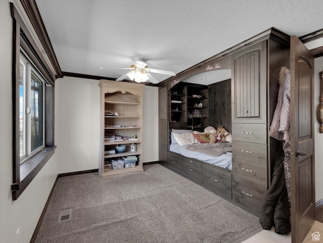 1271 E Oakridge Rd S, Park City, UT 84098 - bedroom featuring a textured ceiling, light colored carpet, visible vents, baseboards, and ornamental molding