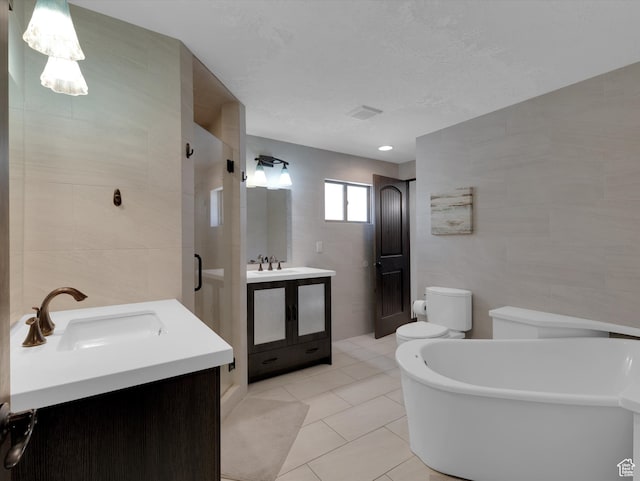 1271 E Oakridge Rd S, Park City, UT 84098 - full bathroom featuring a freestanding tub, two vanities, a sink, and tile walls