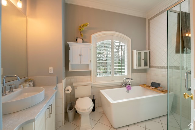 2227 E 5340 S, Holladay, UT 84117 - bathroom with vanity, a soaking tub, crown molding, tile walls, and toilet