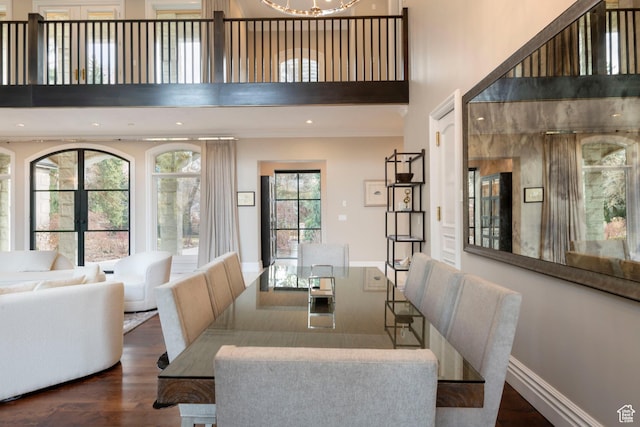 2227 E 5340 S, Holladay, UT 84117 - dining area featuring dark wood-type flooring, a high ceiling, a notable chandelier, and baseboards