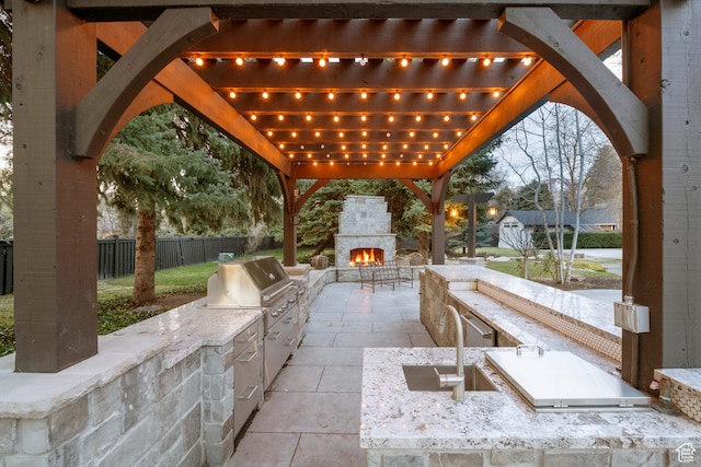 2227 E 5340 S, Holladay, UT 84117 - view of patio / terrace with exterior kitchen, fence, a pergola, and an outdoor stone fireplace