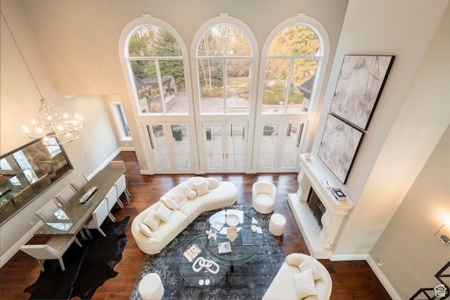 2227 E 5340 S, Holladay, UT 84117 - living room with a high ceiling, wood finished floors, baseboards, and a chandelier