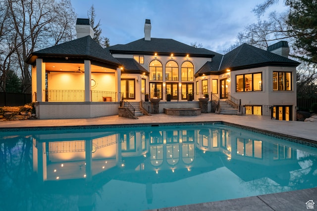 2227 E 5340 S, Holladay, UT 84117 - back of house with a ceiling fan, french doors, an outdoor pool, a chimney, and a patio area