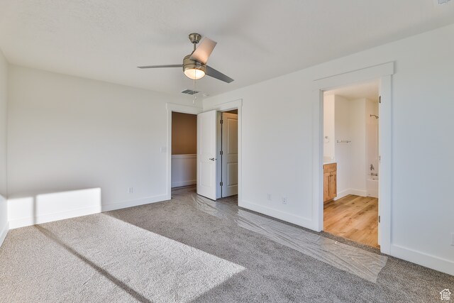 112 E 730 N Unit 102, Tooele, UT 84074 - unfurnished bedroom featuring carpet flooring, a closet, ceiling fan, and ensuite bathroom