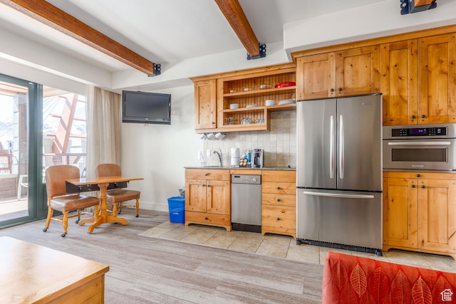 kitchen with tasteful backsplash, stainless steel appliances, light tile floors, and beamed ceiling