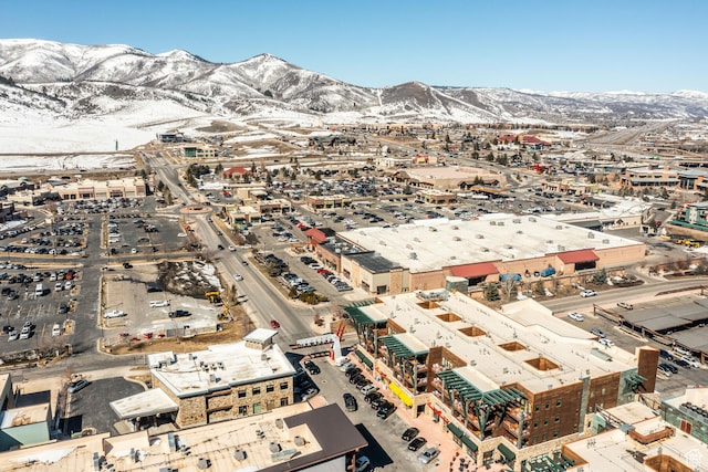 birds eye view of property with a mountain view